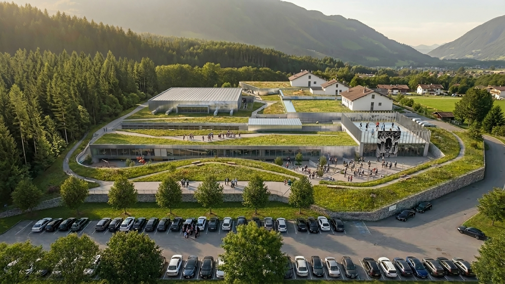 Vista prospettica del progetto della nuova Scuola Elementare di Rablà: integrazione tra il nuovo complesso scolastico e il contesto montano di Parcines.